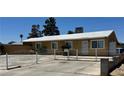 Charming single-story home with a gated front yard and mature trees at 5157 New Bedford Dr, Las Vegas, NV 89122