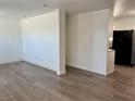 Spacious living room featuring wood-look floors and a bright atmosphere at 5157 New Bedford Dr, Las Vegas, NV 89122