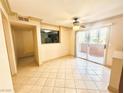 Inviting living room with a ceiling fan and sliding glass doors to a balcony at 8101 W Flamingo Rd # 1044, Las Vegas, NV 89147