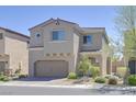Two-story home with a two car garage and desert landscaping at 8919 Don Valley Ave, Las Vegas, NV 89148