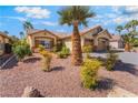Attractive home with desert landscaping, a spacious driveway, and a two-car garage at 1363 Yeager Ave, Las Vegas, NV 89123