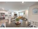 Open-concept living space featuring a modern kitchen, dining area, and comfortable seating at 2657 Fawn Beige Ct, North Las Vegas, NV 89086