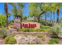 Beautiful Red Rock Country Club signage with well-maintained landscaping in a desert setting at 2885 Red Springs Dr, Las Vegas, NV 89135