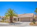 Beautiful single-story home featuring a tile roof, desert landscape, and attached garage at 3101 Hayden Ct, Las Vegas, NV 89134