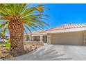 Attractive single-story home showcasing desert landscaping, tile roof, and attached garage at 3101 Hayden Ct, Las Vegas, NV 89134