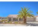 Inviting single-story house with a tile roof and a well-manicured desert landscape at 3101 Hayden Ct, Las Vegas, NV 89134