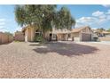 Lovely single-story home with desert landscaping, mature tree, and two car garage at 3249 Palmdesert Way, Las Vegas, NV 89120