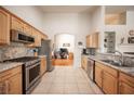 Well-equipped kitchen boasts stainless steel appliances, granite countertops, and ample cabinet space at 3696 Waynesvill St, Las Vegas, NV 89122