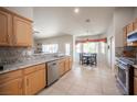 Bright and airy kitchen featuring a breakfast nook and granite countertops at 3696 Waynesvill St, Las Vegas, NV 89122