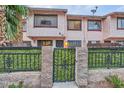 Inviting townhome featuring secure gated entry and lush greenery at 4338 Caliente St # 11, Las Vegas, NV 89119