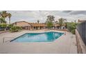Community pool and spa with ample deck space for relaxation and socializing at 4338 Caliente St # 11, Las Vegas, NV 89119