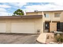 Attached garage and gated front porch area of this charming townhome at 555 Rene Ln, Henderson, NV 89015