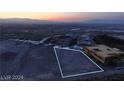 Aerial view of a property lot with mountain views and nearby community development at 611 Grand Rim Dr, Henderson, NV 89012