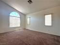 Bright bedroom with large windows and neutral carpeting at 632 Hitchen Post Dr, Henderson, NV 89011