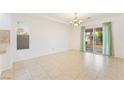 Bright dining area with tile flooring, sliding door, and light-colored walls at 810 Socorro Song Ln, Henderson, NV 89052