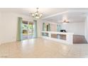 Spacious living room with tile flooring, sliding door, and natural light at 810 Socorro Song Ln, Henderson, NV 89052