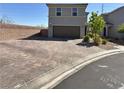 Charming two-story home features brick driveway, a two-car garage, and xeriscape landscaping at 8710 Beverly Grove Ct, Las Vegas, NV 89113
