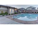 Community pool featuring a shower and nearby outdoor seating at 10422 Prairie Mountain Ave, Las Vegas, NV 89166