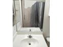 Bathroom featuring a single sink vanity with a framed mirror and tile flooring at 10525 Autumn Pine Ave # 203, Las Vegas, NV 89144