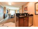 Kitchenette with a sink, dishwasher, and dark countertops at 125 E Harmon Ave # 2514, Las Vegas, NV 89109