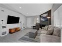 Open-concept living room with large TV, fireplace, and comfortable seating at 1575 W Warm Springs Rd # 1124, Henderson, NV 89014