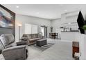 Open living room with hardwood floors and comfortable seating at 1575 W Warm Springs Rd # 1124, Henderson, NV 89014