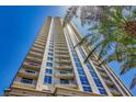 High-rise with wrap-around balconies, floor-to-ceiling windows, with palm trees in view on a beautiful, sunny day at 200 W Sahara Ave # 3312, Las Vegas, NV 89102