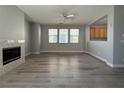 Open living room with a fireplace and plenty of natural light at 258 Bella Matese Ave, Las Vegas, NV 89183
