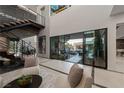 Elegant living room with staircase and spiral staircase at 2655 Juniper Branch St, Las Vegas, NV 89117