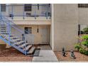 Close up of condo entrance with blue railing steps, front door and decorative statues at 2725 S Nellis Blvd # 1052, Las Vegas, NV 89121