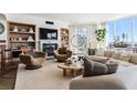 Bright living room features a fireplace, herringbone floors, city views, and stylish contemporary decor at 2857 Paradise Rd # 2203, Las Vegas, NV 89109