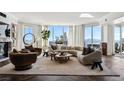 Bright living room features a fireplace, herringbone floors, city views, and stylish contemporary decor at 2857 Paradise Rd # 2203, Las Vegas, NV 89109
