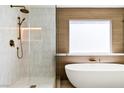 Modern bathroom with soaking tub, frameless shower and designer bronze fixtures at 2937 Billy Casper Dr, Las Vegas, NV 89134