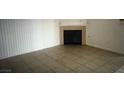 Living room featuring tile flooring, natural light, and a fireplace at 3041 Casey Dr # 101, Las Vegas, NV 89120