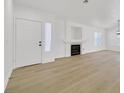 Bright living room with hardwood floors, fireplace and plenty of natural light at 4137 Buffalo Bill Ave, Las Vegas, NV 89110