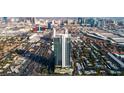 Aerial view of a modern high-rise building and surrounding Las Vegas cityscape at 4381 W Flamingo Rd # 57306, Las Vegas, NV 89103