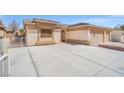 Well-maintained home showcasing an extra-long driveway and a two-car garage at 5224 Red Vine St, North Las Vegas, NV 89031