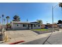 Charming single-story residence with a low-maintenance yard and secure chain-link fence at 5409 Holmby Ave, Las Vegas, NV 89146