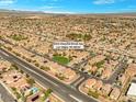 Expansive aerial view of the community, showcasing a lush park and well-planned streets at 8453 Cheerful Brook Ave, Las Vegas, NV 89143