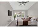 Cozy main bedroom featuring a bay window, neutral color palette, and a ceiling fan at 9513 Yucca Blossom Dr, Las Vegas, NV 89134