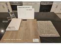 Design layout featuring sleek chrome kitchen faucet and luxurious vinyl plank in Toasted Taupe at 9548 Hinson St, Las Vegas, NV 89139