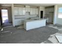 Bright kitchen featuring white cabinets, a center island, and ample counter space at 9548 Hinson St, Las Vegas, NV 89139