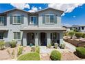 Charming townhome with well-maintained landscaping, neutral exterior paint, shutters, covered porch, and inviting curb appeal at 965 Nevada State Dr # 35101, Henderson, NV 89002