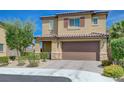 Charming two-story home featuring a well-manicured front yard and inviting curb appeal at 9990 Perth Ct, Las Vegas, NV 89141