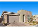 Charming one-story home featuring a two-car garage, stone accents, and well-maintained landscaping at 12476 Heritage Bend Dr, Las Vegas, NV 89138