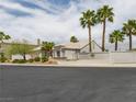 Charming single-story home with desert landscaping and tall palm trees at 2212 Marble Gorge Dr, Las Vegas, NV 89117