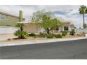 Charming single-story home showcasing a well-manicured front yard and attached two-car garage at 2212 Marble Gorge Dr, Las Vegas, NV 89117