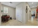 Bright hallway with tiled floor leading to multiple rooms, showcasing open floor plan at 703 Shiva St, Las Vegas, NV 89178