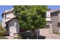 Lovely home featuring a spacious front yard with mature trees and a well-manicured lawn at 7788 Ebro Valley Ct, Las Vegas, NV 89113