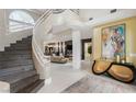 Spacious living room with a staircase, modern fireplace and decor at 8109 Moonstone Cir, Las Vegas, NV 89128